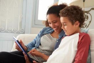 Mom and son looking at digital device